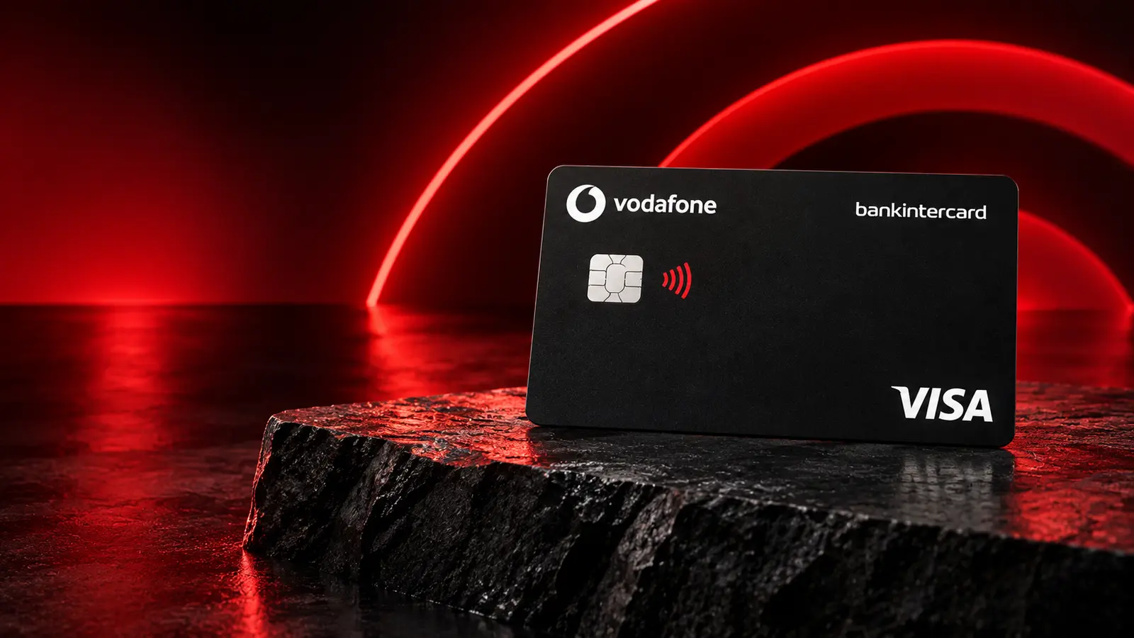 Cartão preto Vodafone bankintercard Visa num cenário com arcos de luz vermelha